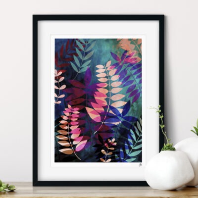 Framed art print featuring layered palm leaves in pink, blue and green.